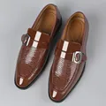 Detail of dark brown leather loafers with crocodile texture and silver metal buckle - EU 38 / Brown