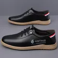 Men's black slip-on casual leather shoes with textured finish and brown rubber sole - EU 38 / Black