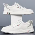 White men's casual sneakers with gray leather trim and red-green stripe details - EU 38 / White