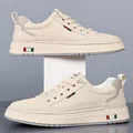 Men's stylish cream leather low-top casual sneakers with red and green stripe web detail - EU 38 / Off White