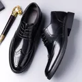 Classic black men's brogue shoes with wingtip perforations and polished leather finish - EU 38 / Black
