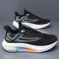 Black fly-knit running shoe with thick gradient white sole and blue geometric patterns - EU 38 / Black