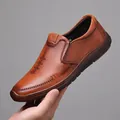 Brown slip-on leather loafers for men with textured finish and V-logo detail - EU 38 / Brown