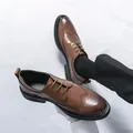 Classic brown leather brogue shoes with wingtip details and decorative perforations - EU 38 / Brown