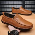 Men's brown leather slip-on loafers with handmade stitching and rubber soles - EU 38 / Brown