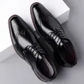 Classic black leather Brogue shoes with intricate perforated carvings and lace-up closure - EU 38 / Black