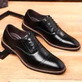Polished black leather oxford shoes with brogue details and brown sole edge accents - EU 38 / Black