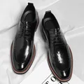Polished black dress shoes for men with moc toe stitching and brown sole accents - EU 37 / Black