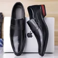 Polished black slip-on business shoes for men featuring brogue details and wood texture heel - EU 38 / Black