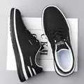 Men's casual sneakers in black faux leather with white midsole and lace-up closure - EU 38 / Black Leather