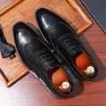 Polished black leather men's formal shoes with heart-shaped stitching and paisley bowtie - EU 38 / Black