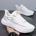 Lightweight white men's sneakers with gray lightning texture and orange sport tag - White Leather