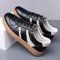 Men's casual leather shoes in black pebble grain with white stripes and gum sole - EU 38 / Black