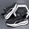 Klassieke zwart-witte platform sneaker met ademend mesh en lederen overlays-ontwerp - EU 38 / Zwart Leer
