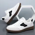 Men's fashion white leather sneaker with grey suede trim and brown rubber sole - EU 38 / White