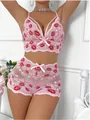 Close-up of pink lace lingerie set with red lip embroidery and heart-shaped patterns - S / Pink