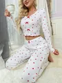 Detail of V-neck heart print loungewear with red bow accents and ruffled edges - S / Top And Bottom / Red