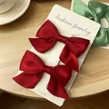 Charming pair of vibrant red ribbon bow hair clips on a white display card for girls - Satin Bow / 2 Pcs/Set / Burgundy
