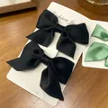 Set of two black satin bow hair clips on a jewelry card, stylish hair accessories - Satin Bow / 2 Pcs/Set / Black