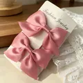 Set of two pink satin bow hair clips for girls displayed on a white fashion jewelry card - Satin Bow / 2 Pcs/Set / Korean Pink