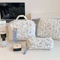 Three-piece quilted floral makeup bag set with blue handle and delicate bird print - Green Leaf White Goose