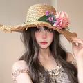 Women's wide brim straw sun hat featuring large pink floral decoration and fringe edge - Khaki Flower (D-581)