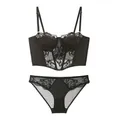 Detail of black lace bustier with underwire cups and matching panty set - S / Black