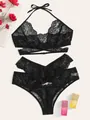 Lace lingerie set with halter top and high-waisted briefs on warm decorative background - XL / Black