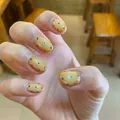 Short oval press-on nails in lemon yellow with light blue polka dot pattern for women - Yellow Blue Polka Dot Style / Box Packaging