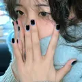 Short square press-on nails with deep black base and blue halo edge design - Night Blue Light