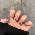 Detailed view of short coffin press-on nails with black gold tiger print and gold studs - M / Charming & Pitiful Style (BY1698)