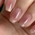 Short square press-on nails with nude pink base and aurora golden french tips - Blush Golden Pattern