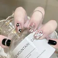 Macro shot of press-on nails featuring 3D white flowers, black gems, and glitter details - M / Dazzling Style (BY1740)