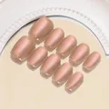 Vista dettagliata di 10 unghie finte rosa nude perlato disposte su uno specchio vintage - Aurora Arancio Dorato (BY1451) / Stile Colla Gel UV (ai-30 Pezzi/Confezione) / Arancione