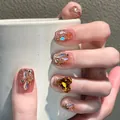 Faux ongles luxe cœur ambre avec strass étincelants et paillettes dorées champagne - Pierre Cœur Ambre (BY1466)