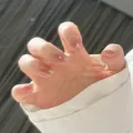Detailed close-up of glossy nude pink square-oval press-on nails with jelly texture - Graceful Style (Liquid Glue)