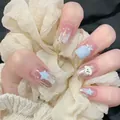 Detail of pink press-on nails featuring 3D blue stars and a cute white bear design - Silver Bear Star