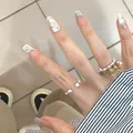 Cat-eye press-on nails with blue stars and cute cartoon kitty and flower designs - Phototherapy Glue Style / 24 Pcs/Set / Purest Sincerity (BY1226)