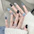 Y2K style short press-on nails with black stars, blue checkerboard, and 3D rhinestones - Phototherapy Glue Style / Sable Fur (BY1211)