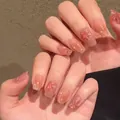 Handmade press-on nails with peach blush gradient, cat eye effect, and pearl firework accents - Phototherapy Glue Style / Fireworks Everywhere (BY1239)
