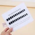 Glossy black press-on nails set with 24 pieces displayed on white card board - Phototherapy Glue Style / BY1349 Black Spar