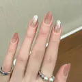 Pink gradient cat-eye press-on nails with 3D bow and red dot accent designs - Boxed Style