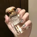 Short handmade press-on nails with silver glitter and rhinestone accents on a transparent base - Phototherapy Glue Style / Eternal Gold and Stone (BY1191)