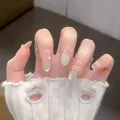 Handmade press-on nails with pearl bows and white gradient on long oval shape - Boxed Version