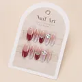 Faux ongles faits main œil de chat avec strass, nœuds rouges et dégradé élégant - Style Nœud en Strass Exquis (BY1962) / Ongles Faits Main Taille M (10 Pcs/Sachet)