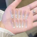 Long almond cat eye press-on nails with pink purple gradient finish on hand - Box Packaging / Gold And Jade Tone