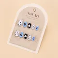 Detail of cute flower nail tips for girls in light blue and black heart patterns - Graffiti Flower (UV Glue Style)