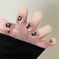Detail of pink cat-eye press-on nails with 3D black flowers and silver crystals - M / Crystal Lantern (BY1741) / 10 Pieces