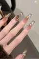 Macro detail of brown cat-eye press-on nails with amber gem and rhinestone crown - By1947 Is Exquisite. / Handmade Size M#10 Pieces/Bag