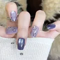 Short square press-on nails featuring deep purple cat-eye and floral pearl designs - Standard Box Set